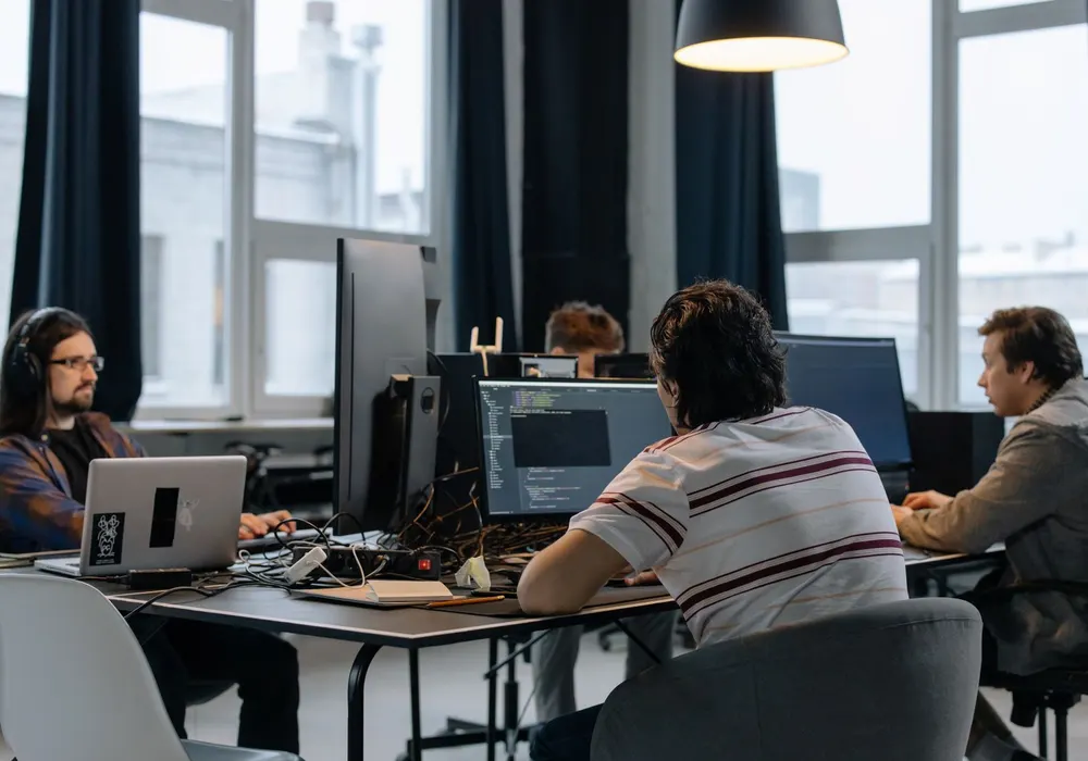 IT professional working at a computer in a modern office