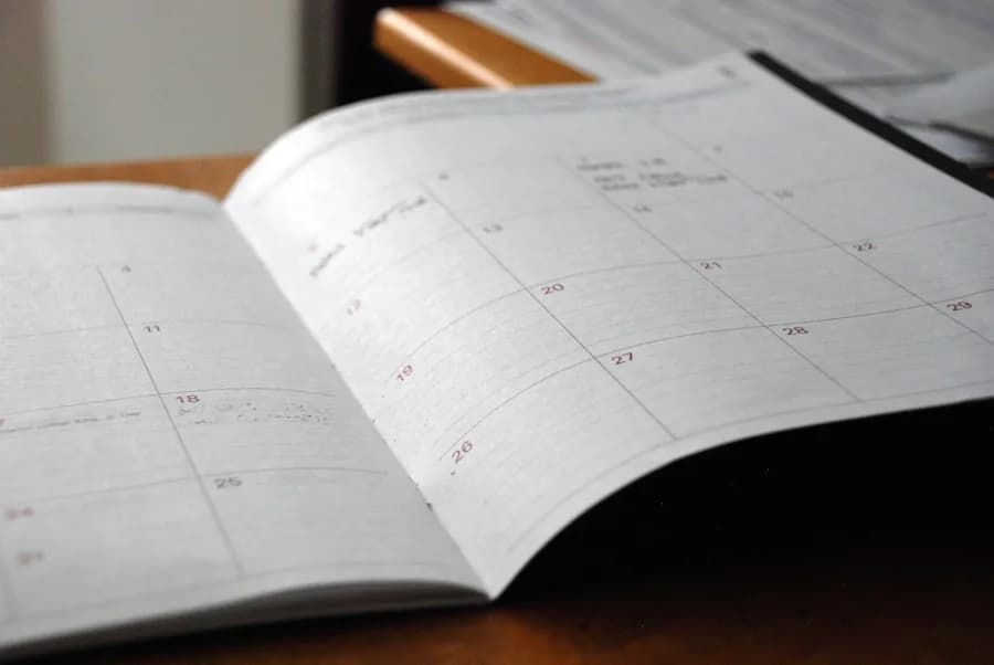 Open paper planner on a wooden desk
